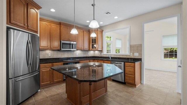 203 Providence Ct, Adams Twp, PA 16059 - kitchen featuring appliances with stainless steel finishes, healthy amount of natural light, a kitchen island, backsplash, and recessed lighting