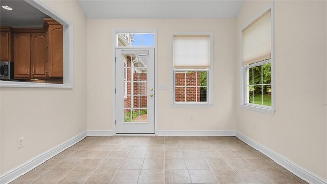 203 Providence Ct, Adams Twp, PA 16059 - doorway to outside featuring baseboards and light tile patterned flooring