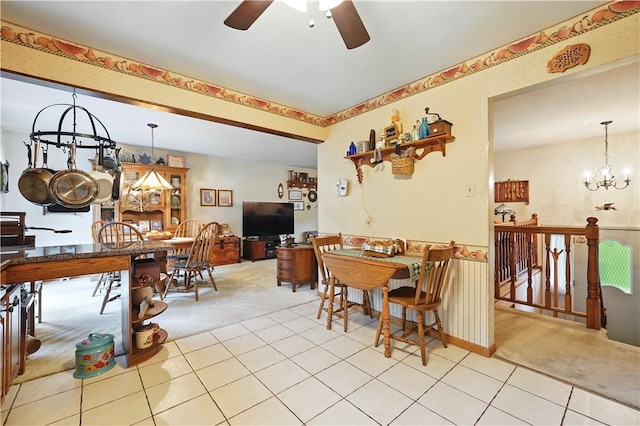 146 Tower Ln, Daugherty Twp, PA 15066 - carpeted dining room featuring a ceiling fan and a chandelier