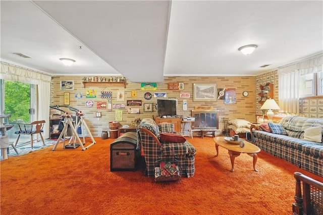 146 Tower Ln, Daugherty Twp, PA 15066 - living room featuring brick wall and carpet