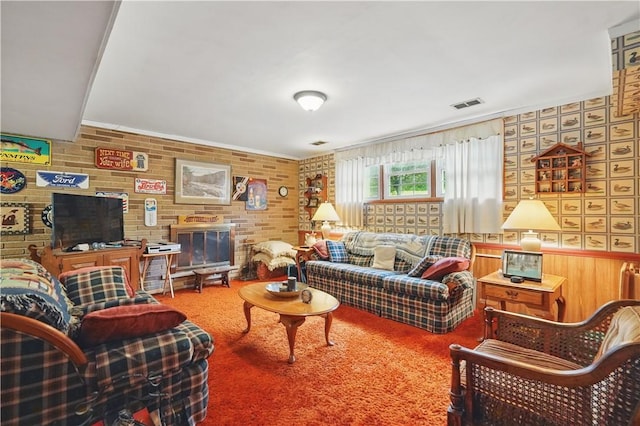 146 Tower Ln, Daugherty Twp, PA 15066 - living room with brick wall and carpet flooring