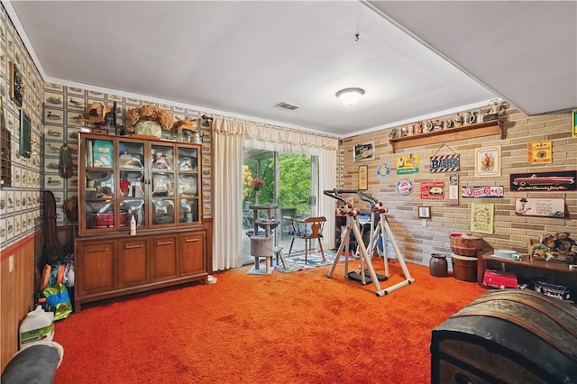 146 Tower Ln, Daugherty Twp, PA 15066 - recreation room with carpet floors, brick wall, and crown molding