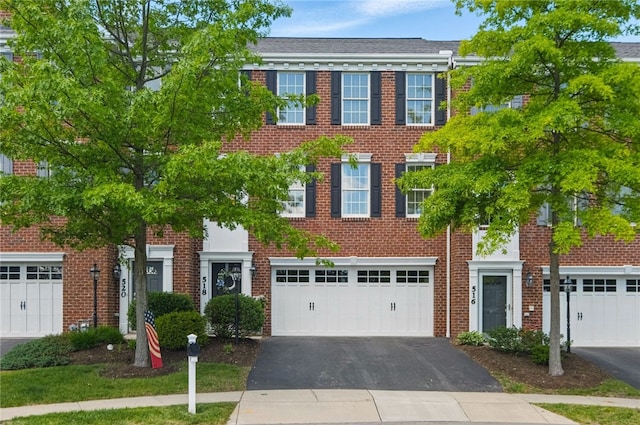 518 Carvine Ct, Marshall, PA 15090 - view of property featuring asphalt driveway, an attached garage, and brick siding
