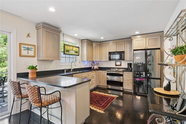 518 Carvine Ct, Marshall, PA 15090 - kitchen with stainless steel appliances, a sink, dark countertops, a peninsula, and light brown cabinets