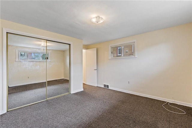 2352 Edgar St, Carrick, PA 15210 - unfurnished bedroom featuring dark colored carpet, a closet, and baseboards
