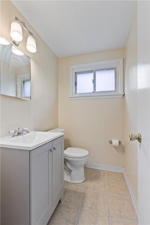 2352 Edgar St, Carrick, PA 15210 - bathroom featuring vanity, toilet, baseboards, and tile patterned floors