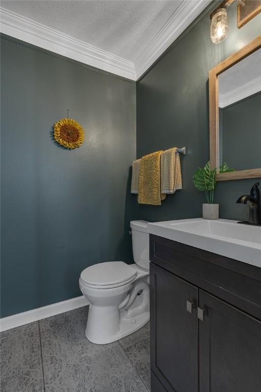6023 Hawthorn Dr, Moon/Crescent Twp, PA 15108 - bathroom with crown molding, vanity, toilet, tile patterned flooring, and baseboards