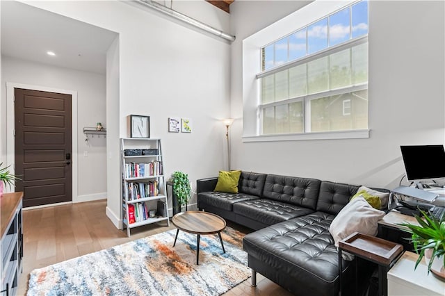 622 Gross St Unit 104, Bloomfield, PA 15224 - living room with wood finished floors, baseboards, and recessed lighting