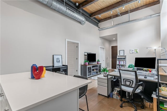622 Gross St Unit 104, Bloomfield, PA 15224 - office space featuring wooden ceiling with exposed beams, a towering ceiling, and light wood-style flooring