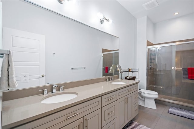 622 Gross St Unit 104, Bloomfield, PA 15224 - bathroom featuring tile patterned floors, double vanity, a stall shower, and toilet