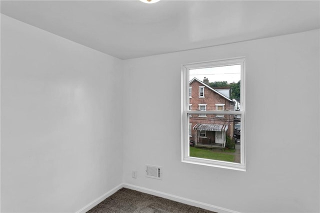 623 E 3rd Ave, Tarentum, PA 15084 - unfurnished room featuring baseboards and dark colored carpet