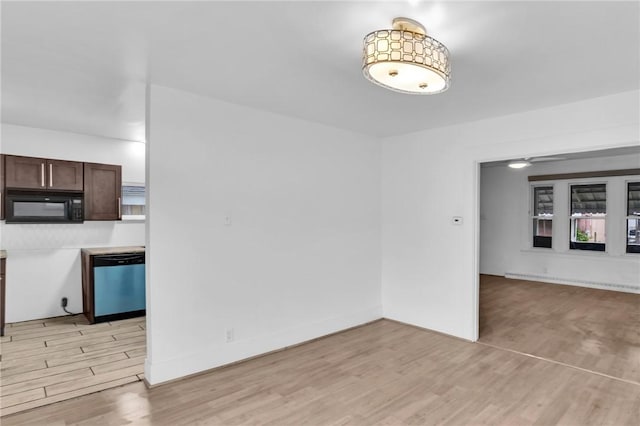 623 E 3rd Ave, Tarentum, PA 15084 - unfurnished living room featuring light wood-style flooring and baseboards