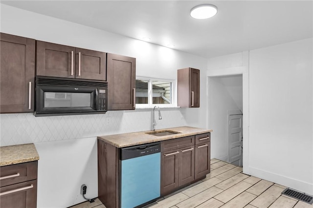 623 E 3rd Ave, Tarentum, PA 15084 - kitchen with dishwasher, black microwave, a sink, and dark brown cabinetry