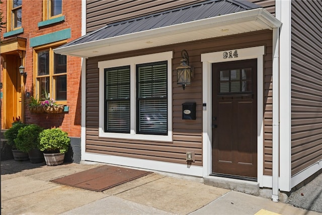 914 James St, East Allegheny, PA 15212 - property entrance featuring brick siding and metal roof