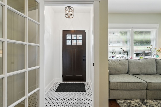 914 James St, East Allegheny, PA 15212 - foyer entrance with a chandelier, baseboards, and wood finished floors
