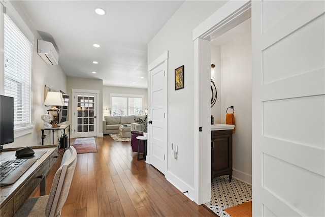 914 James St, East Allegheny, PA 15212 - corridor featuring a wall mounted air conditioner, wood finished floors, recessed lighting, and baseboards