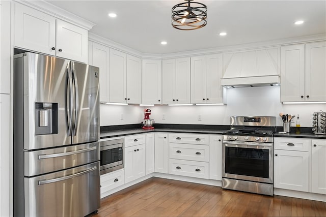 914 James St, East Allegheny, PA 15212 - kitchen with stainless steel appliances, custom range hood, dark countertops, white cabinetry, and dark wood finished floors