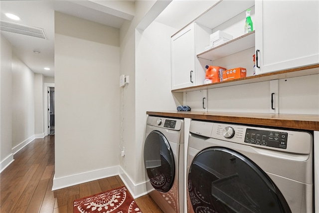 914 James St, East Allegheny, PA 15212 - laundry room with washer and clothes dryer, cabinet space, dark wood-style floors, and baseboards