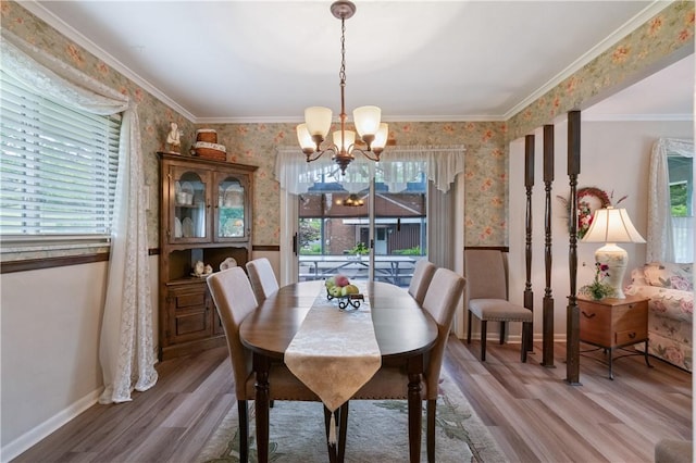 407 Neola Cir, Ross Twp, PA 15237 - dining area with a chandelier, wallpapered walls, wood finished floors, baseboards, and crown molding