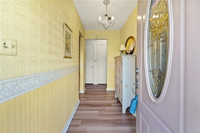407 Neola Cir, Ross Twp, PA 15237 - entryway with wallpapered walls, a chandelier, light wood-style floors, and baseboards