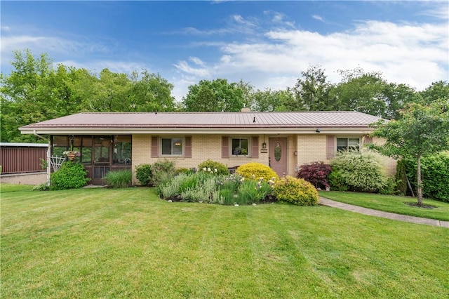 407 Neola Cir, Ross Twp, PA 15237 - ranch-style house featuring brick siding, a sunroom, a front lawn, and metal roof