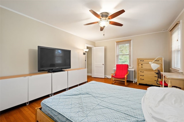 2323 Tilbury Ave, Squirrel Hill, PA 15217 - bedroom featuring wood finished floors, radiator heating unit, ceiling fan, and crown molding