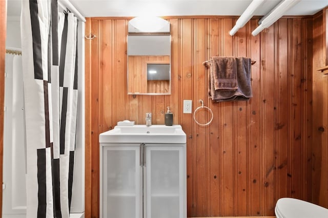 2323 Tilbury Ave, Squirrel Hill, PA 15217 - bathroom featuring vanity, toilet, and wooden walls