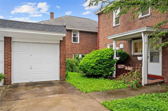 2323 Tilbury Ave, Squirrel Hill, PA 15217 - view of side of home featuring a shingled roof, brick siding, driveway, and an attached garage