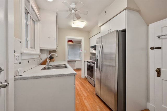2323 Tilbury Ave, Squirrel Hill, PA 15217 - kitchen with appliances with stainless steel finishes, a sink, white cabinetry, light wood-type flooring, and a ceiling fan