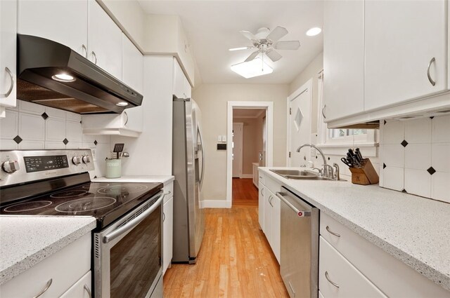 2323 Tilbury Ave, Squirrel Hill, PA 15217 - kitchen featuring stainless steel appliances, extractor fan, a sink, white cabinetry, and recessed lighting