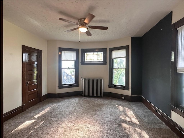 150 Euclid Ave, Sharon, PA 16146 - unfurnished living room featuring radiator, carpet, a textured ceiling, and ceiling fan