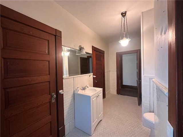 150 Euclid Ave, Sharon, PA 16146 - bathroom with vanity, wainscoting, tile patterned flooring, and tile walls
