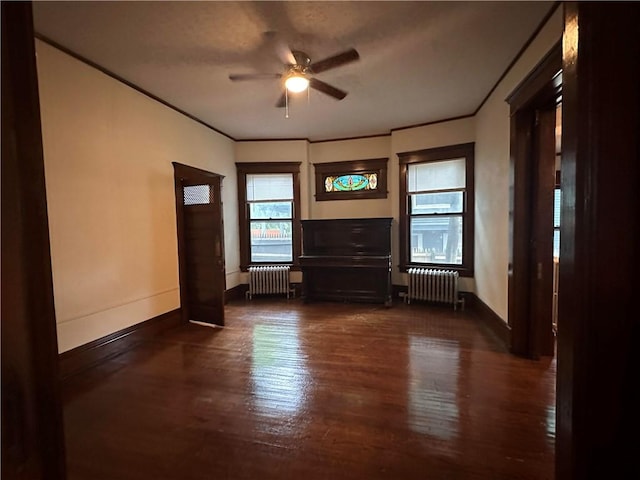 150 Euclid Ave, Sharon, PA 16146 - unfurnished living room with radiator, a ceiling fan, dark wood-style floors, and ornamental molding