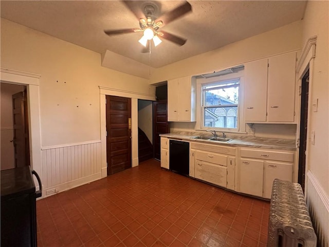 150 Euclid Ave, Sharon, PA 16146 - kitchen with dishwasher, light countertops, a wainscoted wall, white cabinetry, and ceiling fan