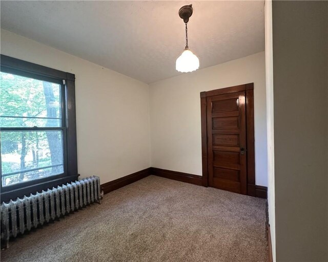 150 Euclid Ave, Sharon, PA 16146 - empty room featuring radiator heating unit and carpet flooring