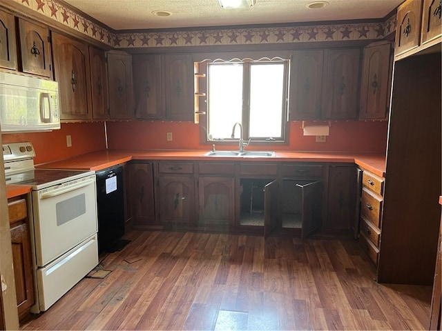 88 Fleming Rd, Pine Twp Mer, PA 16127 - kitchen featuring white range with electric stovetop, a sink, black dishwasher, light wood-style flooring, and light countertops