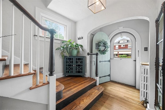1437 Browning Rd, Highland Park, PA 15206 - foyer entrance with stairway, wood finished floors, and arched walkways
