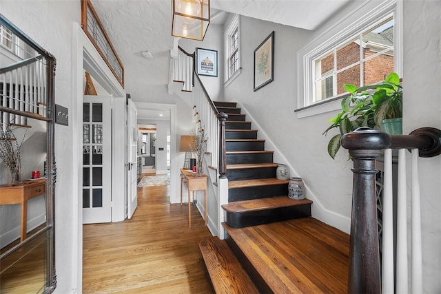 1437 Browning Rd, Highland Park, PA 15206 - entrance foyer with wood finished floors, stairs, and baseboards