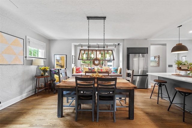 1437 Browning Rd, Highland Park, PA 15206 - dining room with wood finished floors, baseboards, and a textured ceiling