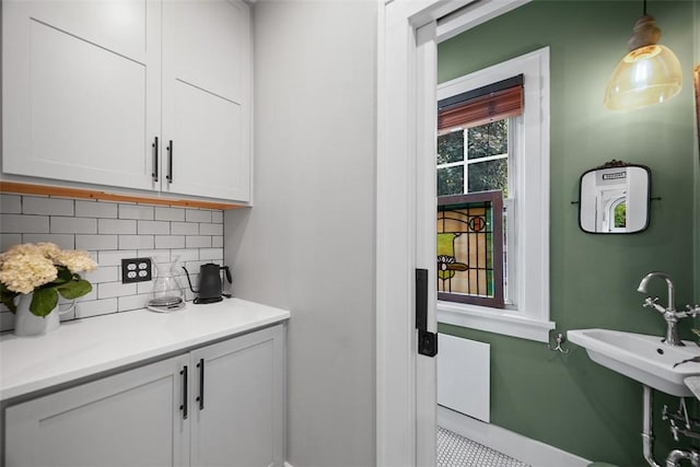 1437 Browning Rd, Highland Park, PA 15206 - bar with tasteful backsplash, baseboards, and pendant lighting