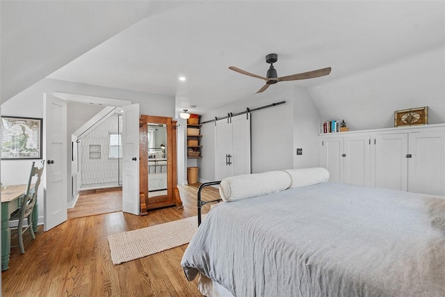 1437 Browning Rd, Highland Park, PA 15206 - bedroom featuring a barn door, wood finished floors, vaulted ceiling, ceiling fan, and recessed lighting
