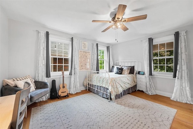 1437 Browning Rd, Highland Park, PA 15206 - bedroom featuring wood finished floors, a ceiling fan, and baseboards