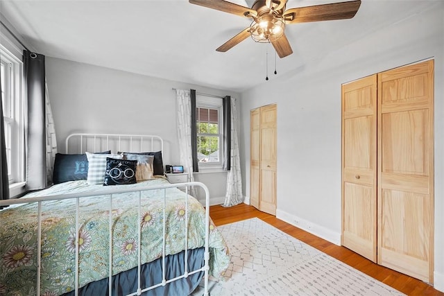1437 Browning Rd, Highland Park, PA 15206 - bedroom with multiple closets, wood finished floors, ceiling fan, and baseboards