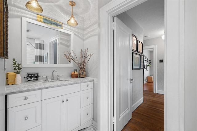 1437 Browning Rd, Highland Park, PA 15206 - bathroom featuring wood finished floors, vanity, and baseboards