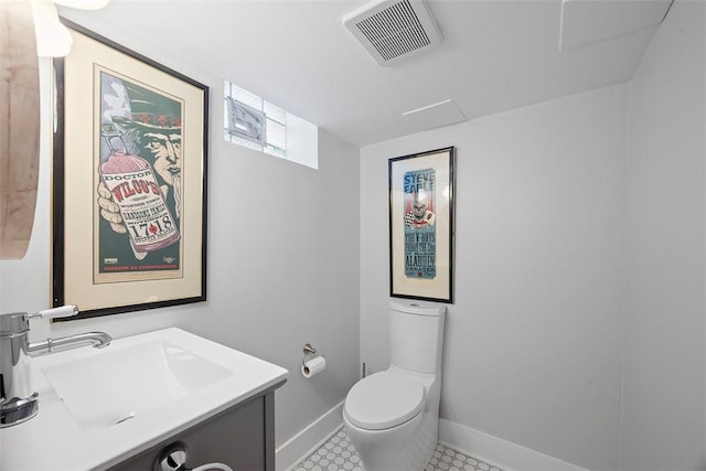 1437 Browning Rd, Highland Park, PA 15206 - bathroom featuring toilet, baseboards, and vanity