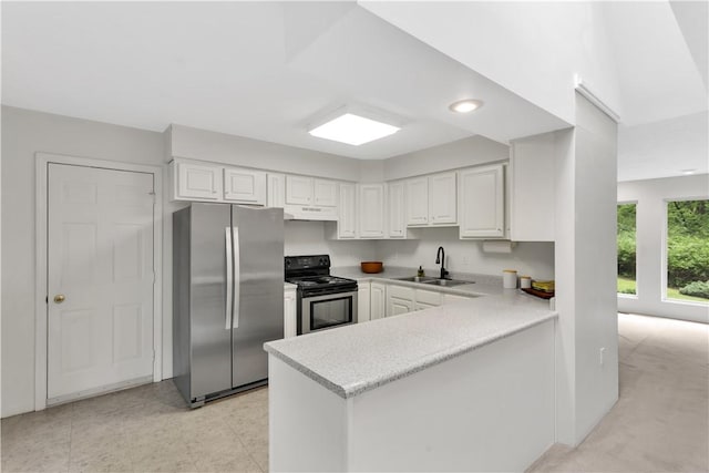 1860 Washington Rd, Washington Twp Wml, PA 15613 - kitchen with freestanding refrigerator, electric stove, a sink, under cabinet range hood, and light countertops