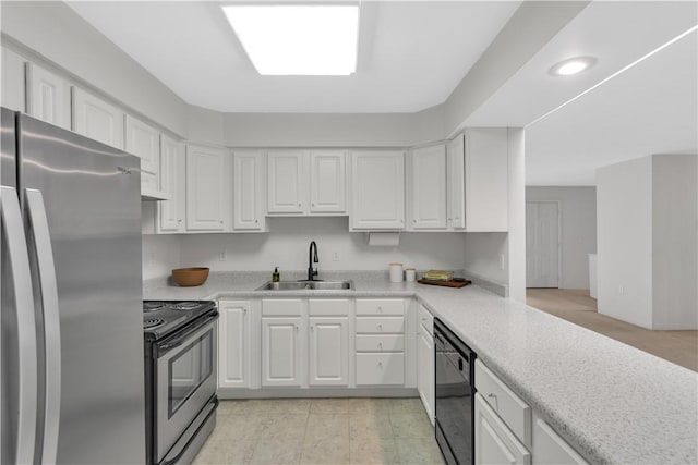 1860 Washington Rd, Washington Twp Wml, PA 15613 - kitchen featuring stainless steel appliances, a sink, light countertops, and white cabinetry