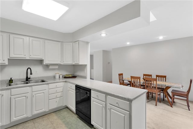 1860 Washington Rd, Washington Twp Wml, PA 15613 - kitchen featuring a sink, black dishwasher, a peninsula, white cabinets, and light countertops