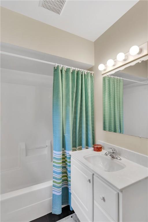 1860 Washington Rd, Washington Twp Wml, PA 15613 - bathroom with vanity and shower / tub combo