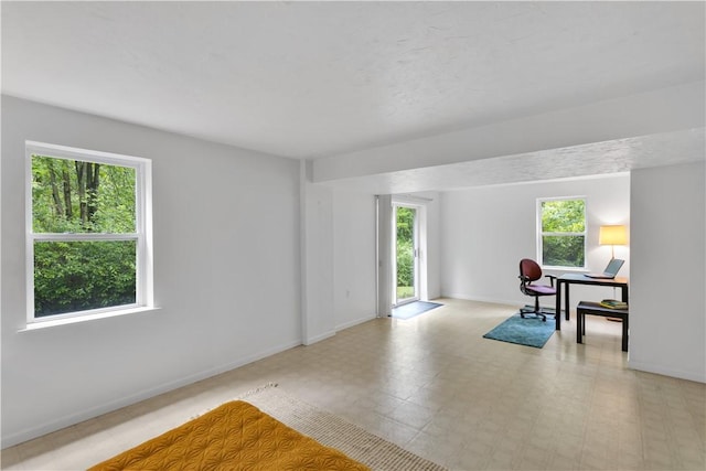 1860 Washington Rd, Washington Twp Wml, PA 15613 - unfurnished room with plenty of natural light, baseboards, and a desk